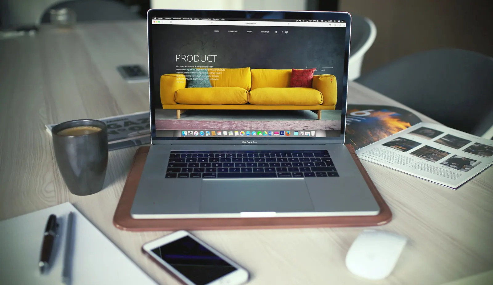 Laptop on a desk displaying a clean modern product website design